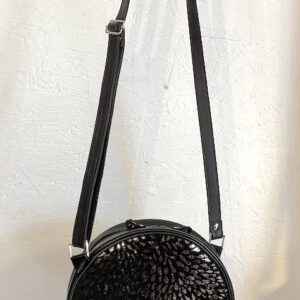 Sac Rond Noir, Motif brillant